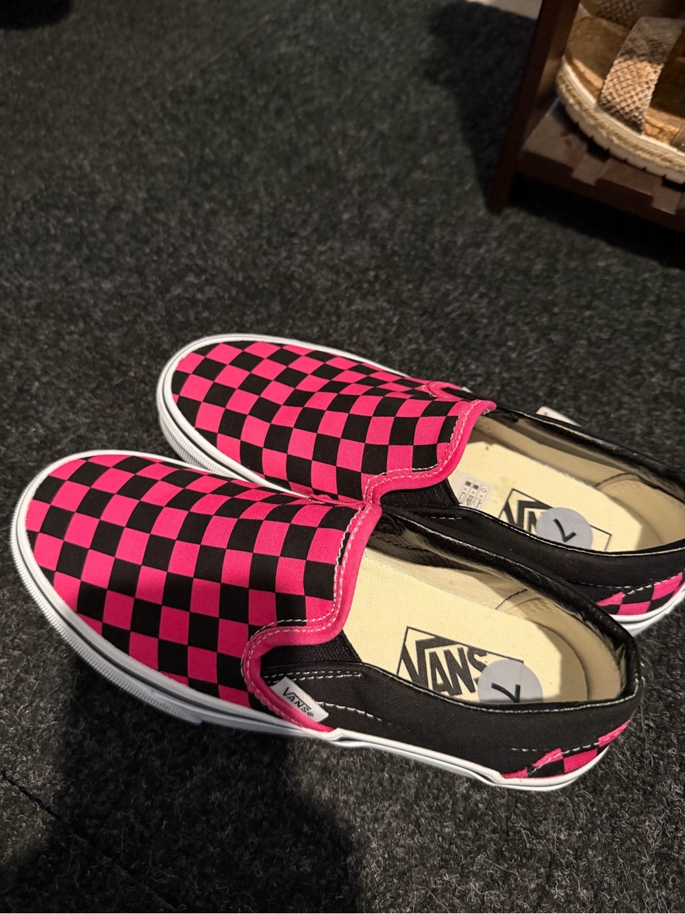Hot pink checkered slip on vans